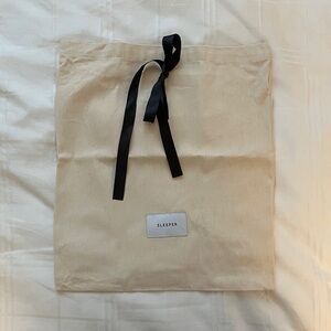 Sleeper Cream Bag with Black Ribbon